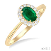 6x4 MM Oval Shape Emerald and 1/6 Ctw Round Cut Diamond Halo Precious Ring in 14K Yellow Gold