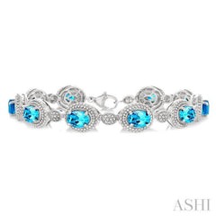 7X5 MM Oval Shape Blue Topaz and 1/10 Ctw Single Cut Diamond Semi-Precious Bracelet in Sterling Silver