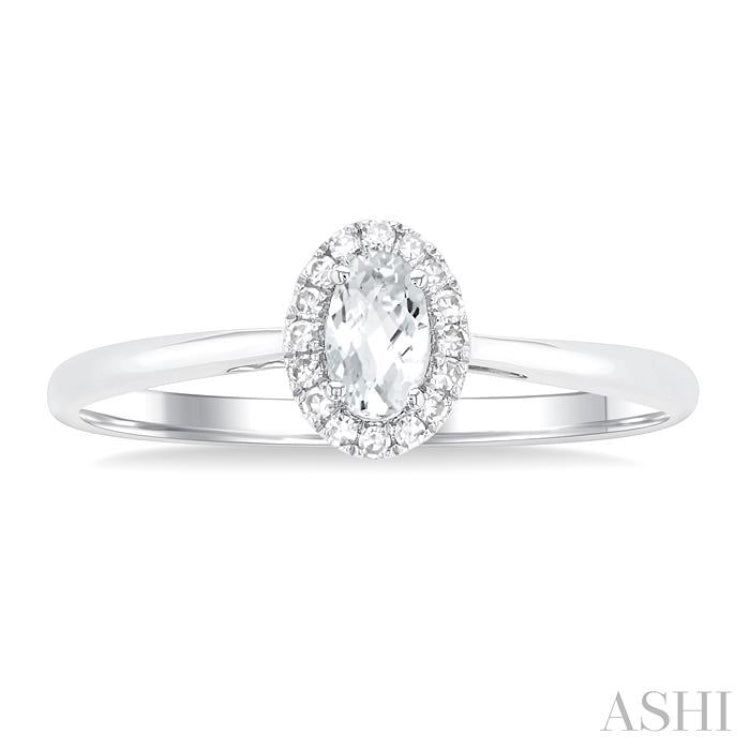 5x3 MM Oval Shape White Topaz and 1/20 Ctw Single Cut Diamond Halo Semi-Precious Ring in 14K White Gold