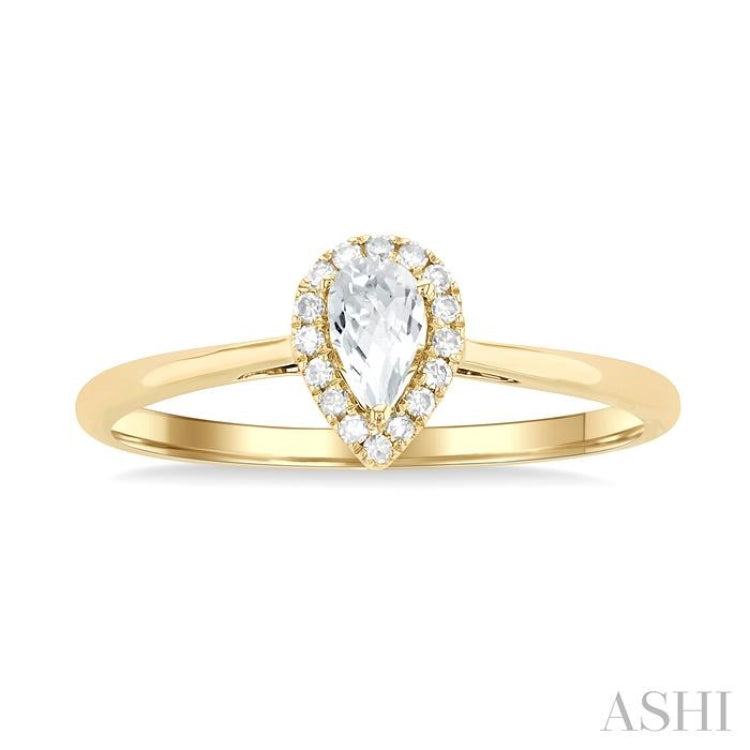 5x3 MM Pear Shape White Topaz and 1/20 Ctw Single Cut Diamond Halo Semi-Precious Ring in 14K Yellow Gold